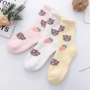 Three pairs of soft coral fleece socks with cartoon bear patterns and ruffled cuffs