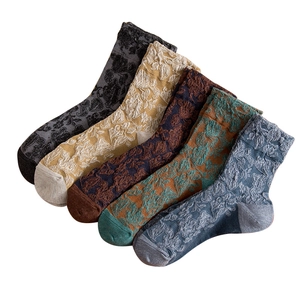 Five pairs of retro floral embossed mid-calf socks in diverse vintage autumn colors