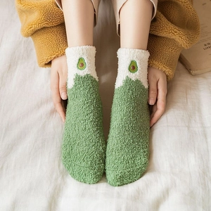 Thick coral fleece socks with green avocado embroidery and warm color-block design