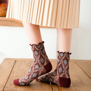 Japanese retro burgundy floral crew socks with ruffle edges on model's feet