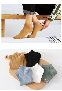Detail view of cotton low-cut ankle socks in various solid colors with ribbed cuffs