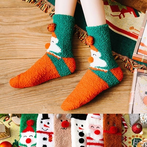 4-pack couple's Christmas coral fleece socks set featuring festive holiday patterns