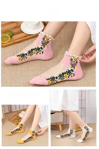 Detailed view of floral embroidery socks with lace trim and pearl accents for women