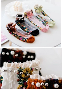 Detail of vintage floral mesh socks with white lace trim and hand-sewn pearl embellishments