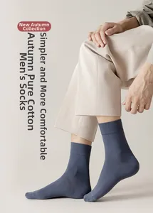 Detail of dark blue-grey cotton crew socks for men showing elasticity and soft texture