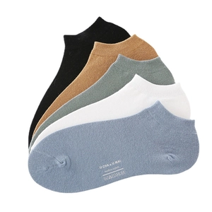 Five pairs of men's cotton boat socks in assorted colors with ribbed cuffs and side logos