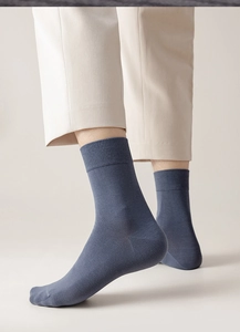 Detail showing the fine rib texture of greyish-blue cotton crew socks for men