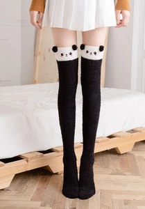 Detail of coral fleece over-knee socks with cute 3D panda ears and embroidery design