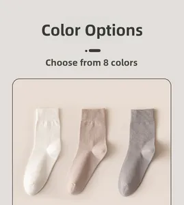 Detail of white, khaki and grey cotton crew socks with premium ribbed cuffs