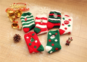 Detailed view of 6-pair Christmas coral fleece socks with elk and Santa embroidery