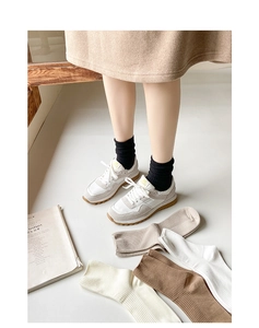 Close-up of vertical ribbed cotton blend mid-calf socks in five neutral classic colors