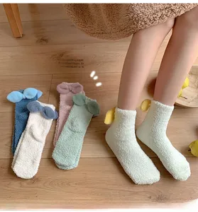 Thick coral fleece socks for women featuring cute 3D bows and soft pastel color options