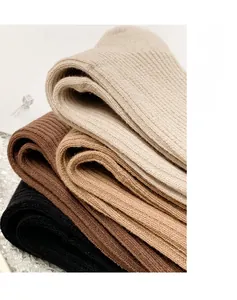 Macro shot of vertical rib knit textures and elastic cotton fabric in earthy tones