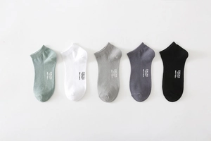Detail view of cotton low-cut ankle socks set in various Morandi colors with printed logos