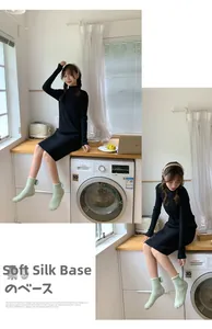 Detail of warm mint green coral fleece socks with 3D decorative bow on cozy knit dress