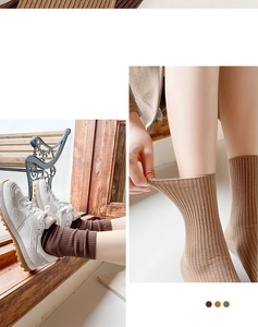 Detailed view of high-elasticity ribbed knit crew socks in deep brown and earthy tones