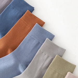 Set of men's crew socks in various solid colors made of premium combed cotton