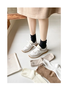 Detailed view of women's ribbed crew socks in multiple neutral colors and soft cotton knit