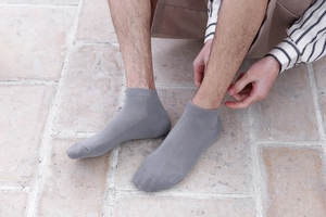 Detail view of grey cotton boat socks with breathable mesh and ribbed elastic cuffs