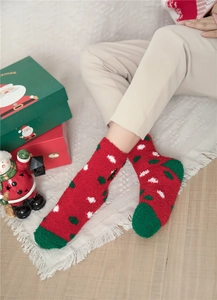 Thick coral fleece Christmas socks in red and green with festive polka dot patterns