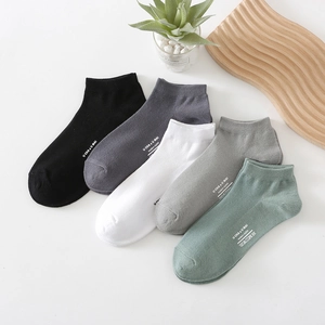 Five pairs of breathable cotton low cut socks in assorted solid colors for men
