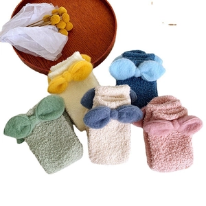 Thick coral fleece socks for women featuring colorful bows and warm winter texture
