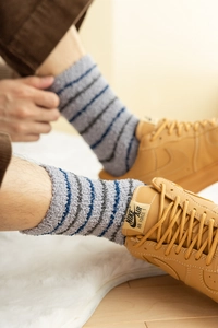 Detail of warm striped thick coral fleece crew socks for men in blue and grey tones