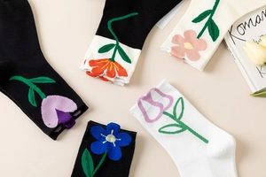 Detailed view of floral cotton socks with 3D tulip patterns and cute artistic designs
