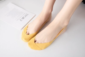 Detail of thin ginger yellow seamless invisible low cut socks for flat shoes