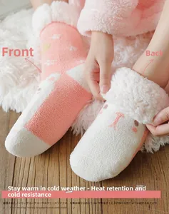 Detailed view of pink coral fleece socks with cute animal face and thick sherpa lining