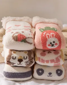 Detailed stack of thick coral fleece socks with cute 3D animal ears and plush cuffs