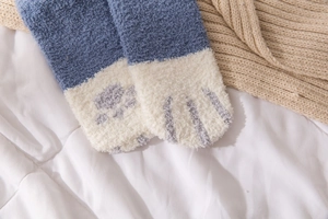 Detail of coral fleece cat claw socks in indigo blue with soft plush texture