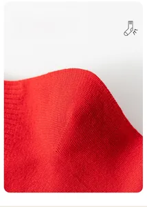 Macro shot of 3D U-shaped heel on red cotton socks for a secure and non-slip fit