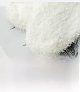 Close-up of neatly stitched toe seam on warm white plush coral fleece socks