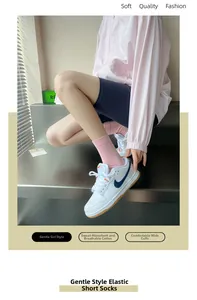 Detail of pink cotton loose-top ankle socks featuring a widened comfort cuff design