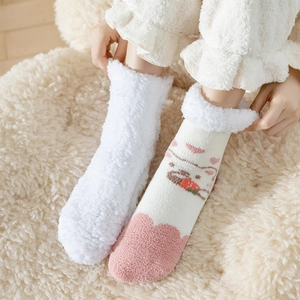 Thick coral fleece socks featuring cute bear patterns and soft plush texture for winter