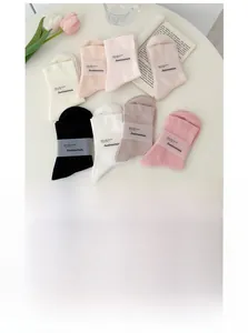 Detailed display of seven colors combed cotton socks set in soft feminine tones