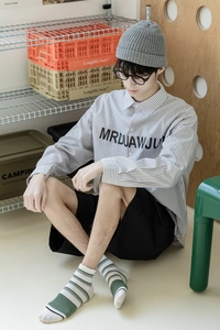 Close-up of men's striped long-sleeve cotton shirt with MRDUAWJU letter print detailing