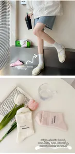 Detail of high-elastic ribbed cuffs on soft cotton socks in cream and pink tones