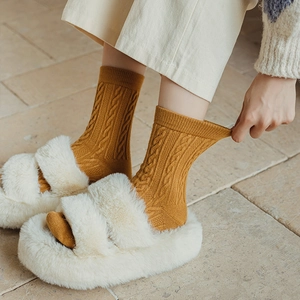 Thick mustard yellow cable knit wool socks for women in winter with elastic cuff