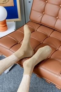 Close-up of khaki ribbed crew socks for men showing premium cotton texture and design