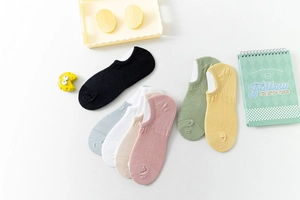 Flat lay of colorful cotton mesh low-cut liner socks in seven assorted pastel shades