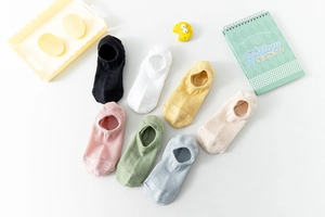 Detailed flat lay of seven breathable mesh cotton no-show socks in diverse pastel colors