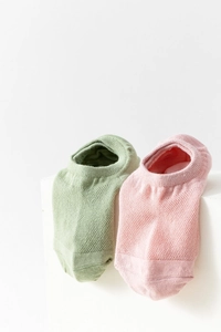 Close-up of breathable mesh cotton boat socks in pale green and light pink colors
