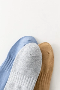 Detailed macro view showing the fine knit texture and stitching of cotton blend ankle socks