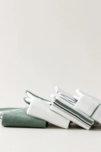 Close-up of stacked cotton socks showing soft knitted texture and diverse stripe patterns