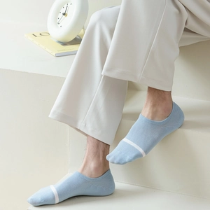 Men's light blue invisible boat socks with white stripes shown on feet against white steps
