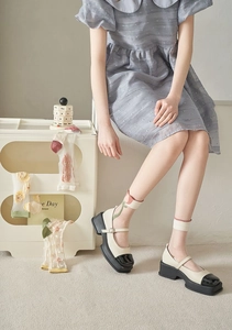 Detail of Mary Jane platform shoes with sheer floral embroidery socks for women
