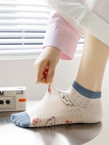 Close-up of breathable mesh bamboo fiber socks with cartoon patterns and high elasticity