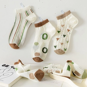 Breathable bamboo fiber ankle socks for women featuring hollow mesh and cartoon patterns